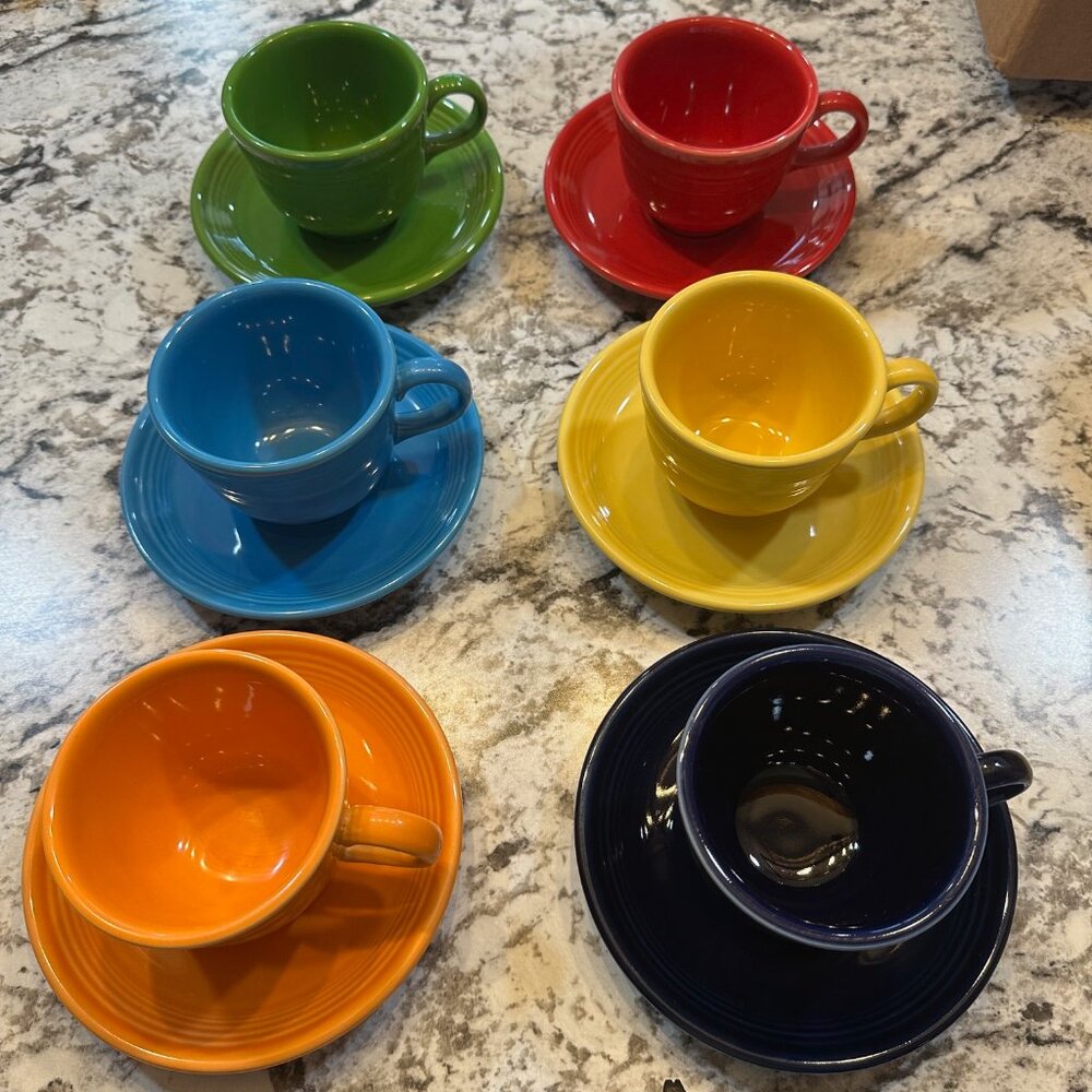 Fiesta Ware cup and saucer sets in various colors